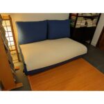 Sofá cama valisse con funda azul y beige